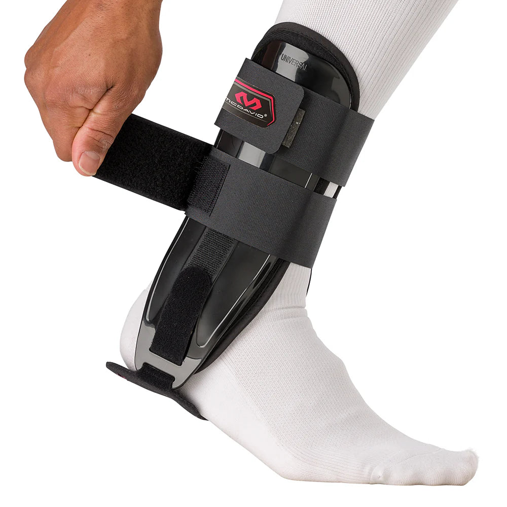 Black ankle support brace on a white background