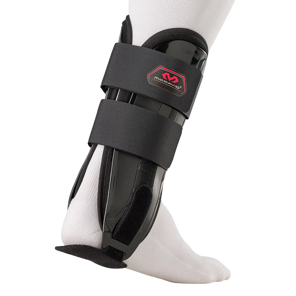 Black protective ankle brace on a white background