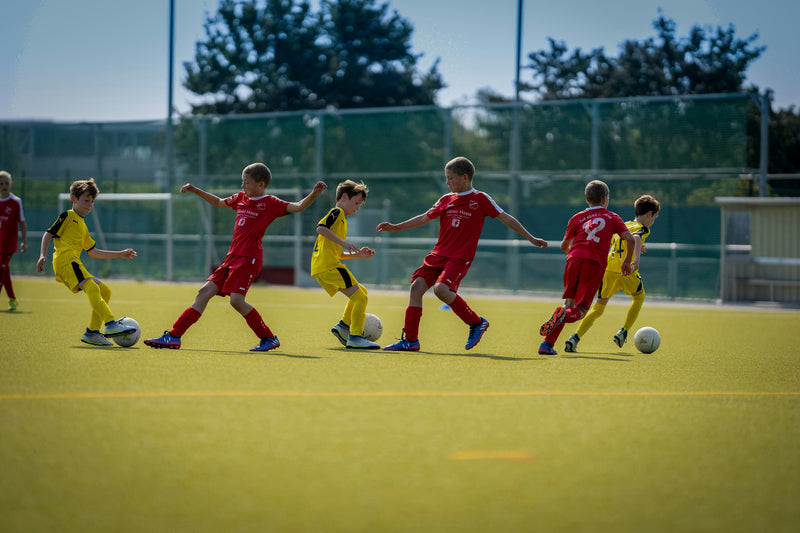 Youth soccer players competing during a match